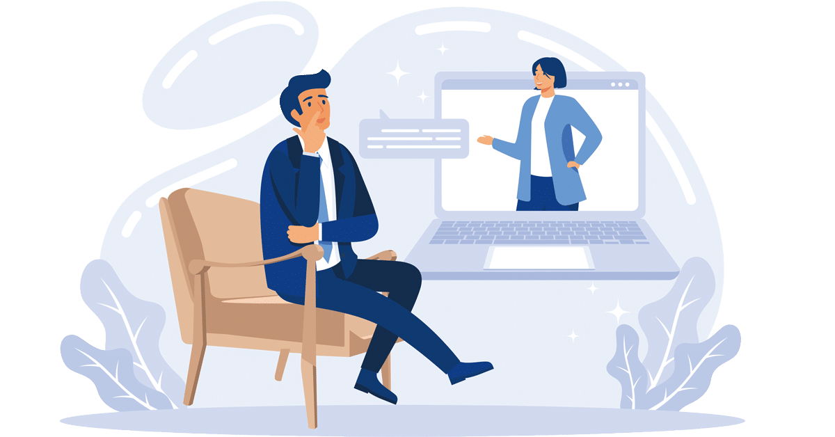 Man in a suit sits in a chair, watching a presenter on a laptop screen during a video conference.